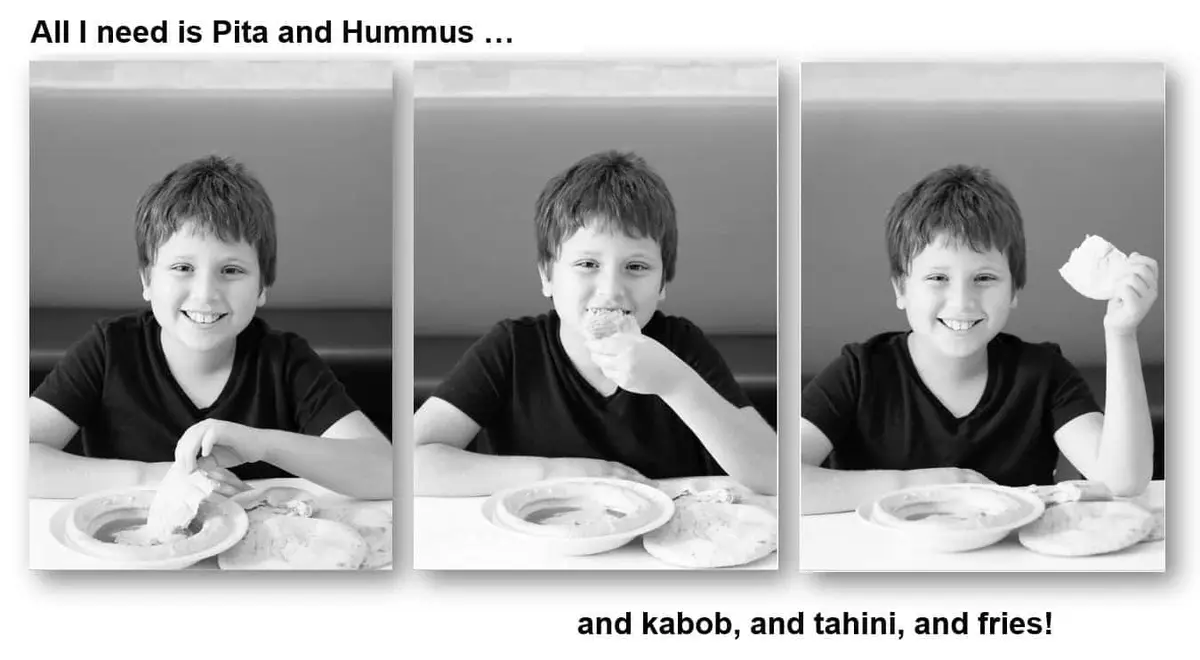 A child tearing into a piece of warm house-made pita at the table
