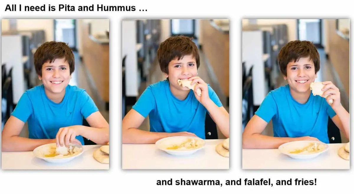 A young guest dipping pita into a bowl of hummus